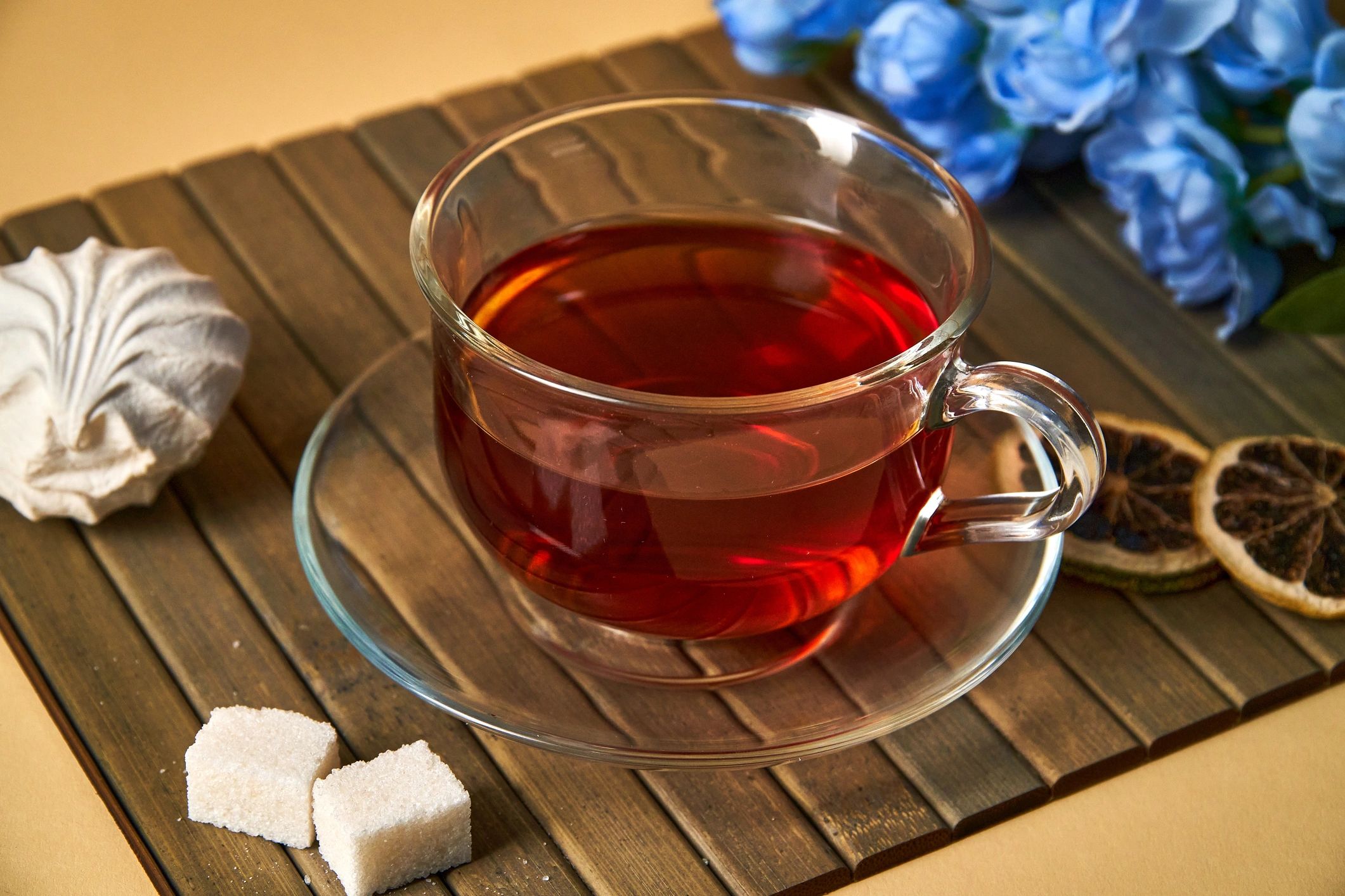 Cup of tea with lime and flowers
