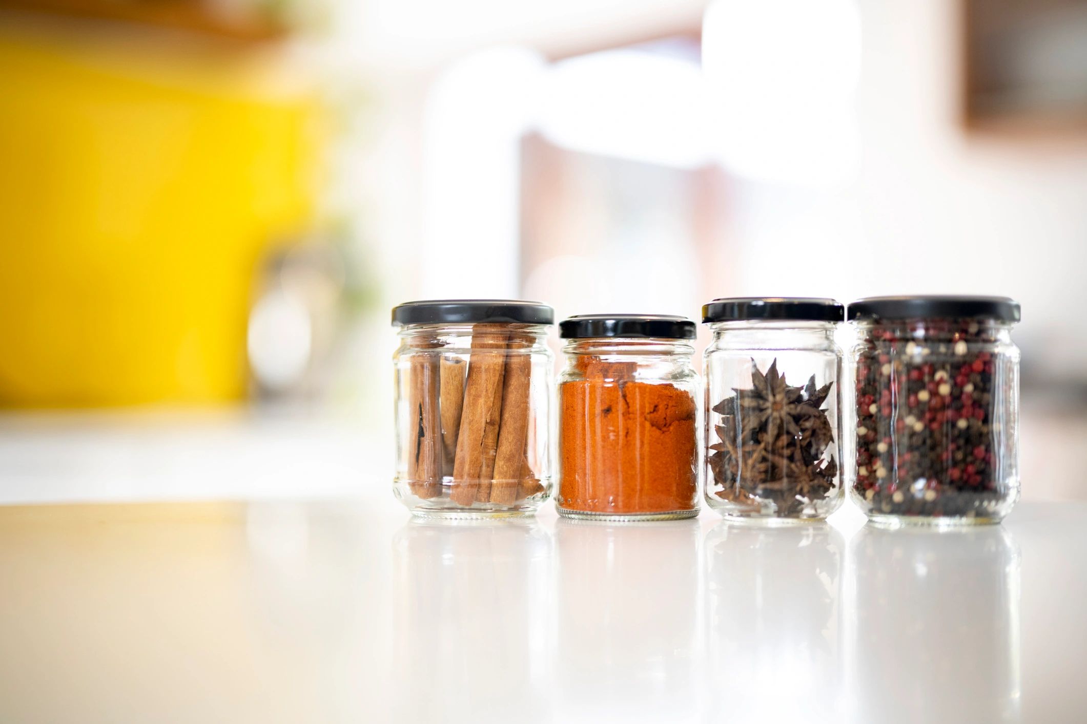 Natural herbs and spices in glass jars